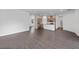Open-concept living room with modern flooring, flowing seamlessly into the kitchen space at 1057 Presque Isle Dr, Port Charlotte, FL 33952