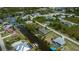Community aerial view showcasing waterfront properties and scenic canals at 13471 Chenille Dr, Port Charlotte, FL 33981