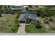 Aerial view showcasing a property with a private pool and a waterfront location with boat dock at 13471 Chenille Dr, Port Charlotte, FL 33981