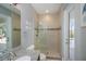 Bathroom featuring tiled shower with glass door and granite countertop at 13471 Chenille Dr, Port Charlotte, FL 33981