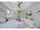 Charming bedroom features a ceiling fan and coastal decor, creating a relaxing ambiance at 13471 Chenille Dr, Port Charlotte, FL 33981