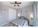 Comfortable bedroom with ceiling fan, and coastal-themed decor, including decorative paddles at 13471 Chenille Dr, Port Charlotte, FL 33981