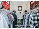 Organized walk-in closet provides ample storage with shelves and rods, perfect for wardrobe management at 13471 Chenille Dr, Port Charlotte, FL 33981