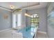 Bright dining room featuring elegant lighting, modern decor, and a calming ambiance at 13471 Chenille Dr, Port Charlotte, FL 33981