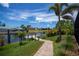 Wooden dock on the canal with views of other homes and docks along the waterway at 13471 Chenille Dr, Port Charlotte, FL 33981