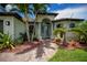 Inviting home with a walkway, lovely landscaping, and a welcoming entryway at 13471 Chenille Dr, Port Charlotte, FL 33981