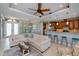 A cozy living space flows into a kitchen and dining area, perfect for modern living at 13471 Chenille Dr, Port Charlotte, FL 33981