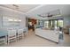 This open-concept features a modern kitchen, a dining area, and a large living room at 13471 Chenille Dr, Port Charlotte, FL 33981