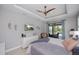 Main bedroom with ceiling fan and access to the screened lanai and pool area at 13471 Chenille Dr, Port Charlotte, FL 33981