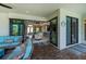 Open concept living with access to a covered patio creating the ultimate space for relaxation and gathering at 13471 Chenille Dr, Port Charlotte, FL 33981