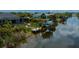 Waterfront home featuring a private boat lift and dock on a tranquil canal at 13471 Chenille Dr, Port Charlotte, FL 33981