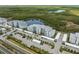 Aerial view of the complex featuring ample parking, nearby lakes and recreational areas at 14141 Heritage Landing Blvd # 912, Punta Gorda, FL 33955