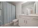 Bright bathroom with a white vanity, shower-tub combination and ample space at 14141 Heritage Landing Blvd # 912, Punta Gorda, FL 33955