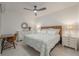 Bright bedroom featuring a decorative mirror, dresser and coordinated lamps on nightstands at 14141 Heritage Landing Blvd # 912, Punta Gorda, FL 33955