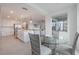 Open dining area adjacent to the kitchen featuring ample light, modern decor, and seamless access to the balcony at 14141 Heritage Landing Blvd # 912, Punta Gorda, FL 33955