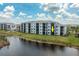 Exterior of the condo complex offering a stunning view of the lake and surrounding landscape at 14141 Heritage Landing Blvd # 912, Punta Gorda, FL 33955