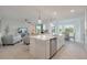 Bright, open kitchen featuring a center island, stainless steel appliances, and seamless flow to living spaces at 14141 Heritage Landing Blvd # 912, Punta Gorda, FL 33955