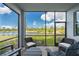 Inviting screened lanai offers serene water views, complete with comfortable seating perfect for relaxation at 14141 Heritage Landing Blvd # 912, Punta Gorda, FL 33955