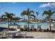 Relaxing pool area with lounge chairs, tropical landscaping, and a view of the sparkling pool at 14141 Heritage Landing Blvd # 912, Punta Gorda, FL 33955