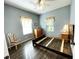 Charming bedroom features hardwood floors, soft natural light, and decorative window treatments at 1431 Red Oak Ln, Port Charlotte, FL 33948