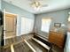 Charming bedroom features hardwood floors, soft natural light, and closet access at 1431 Red Oak Ln, Port Charlotte, FL 33948