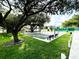 Enjoy a game of bocce ball on this well-maintained court surrounded by lush landscaping and seating at 1431 Red Oak Ln, Port Charlotte, FL 33948