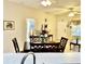 Dining area showcasing a wood table and chairs, open to the living area at 1431 Red Oak Ln, Port Charlotte, FL 33948