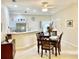Inviting dining room adjacent to the kitchen, complete with a wooden table and seating for four at 1431 Red Oak Ln, Port Charlotte, FL 33948