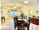 Open-concept dining area, seamlessly connected to the living room, and bathed in natural light at 1431 Red Oak Ln, Port Charlotte, FL 33948