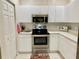 Well-lit kitchen with modern appliances, lots of cabinetry and counter space at 1431 Red Oak Ln, Port Charlotte, FL 33948