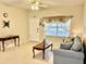 Bright living room with large window, decorative curtains, and a comfortable sofa at 1431 Red Oak Ln, Port Charlotte, FL 33948