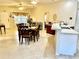 The home features an open floor plan joining the kitchen, dining, and living room areas at 1431 Red Oak Ln, Port Charlotte, FL 33948