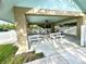 This covered outdoor patio area features picnic tables and chairs, offering a comfortable space for gatherings at 1431 Red Oak Ln, Port Charlotte, FL 33948