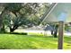 Picturesque park view featuring a gazebo, lush lawn, and serene lake backdrop at 1431 Red Oak Ln, Port Charlotte, FL 33948