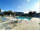 Community pool area with plenty of seating for residents to enjoy a relaxing outdoor atmosphere at 1431 Red Oak Ln, Port Charlotte, FL 33948