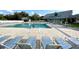 This large community pool has plenty of seating, including tables with umbrellas, and stairs for easy access at 1431 Red Oak Ln, Port Charlotte, FL 33948