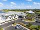 Aerial view of a community clubhouse with palm trees and lush landscaping at 15039 Black Cherry Way, Punta Gorda, FL 33955