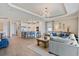 Open concept kitchen and living room with large island and stainless steel appliances at 15039 Black Cherry Way, Punta Gorda, FL 33955