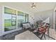 Outdoor patio with comfortable seating, a grill, and views of the lake at 15039 Black Cherry Way, Punta Gorda, FL 33955