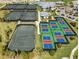 Aerial view of the tennis and pickleball courts, community pool, and clubhouse at 15039 Black Cherry Way, Punta Gorda, FL 33955