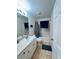 Cozy bathroom with tile floors, vanity, toilet, and shower-tub combo at 1609 Log Ln, North Port, FL 34286