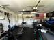 Garage featuring laundry machines, workout equipment, and motorized vehicles at 1609 Log Ln, North Port, FL 34286