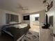 Cozy main bedroom featuring neutral walls, carpet flooring, and an ensuite bathroom at 1609 Log Ln, North Port, FL 34286