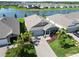 Beautiful waterfront home with paver driveway and lush landscaping in a well-maintained community at 16824 Canopy Garden Dr, Port Charlotte, FL 33953