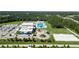 Community recreation center featuring a pool, park, sports courts, and ample parking at 16824 Canopy Garden Dr, Port Charlotte, FL 33953