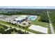Community recreation center featuring a pool, park, sports courts, and ample parking at 16824 Canopy Garden Dr, Port Charlotte, FL 33953