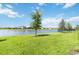 Scenic backyard with a pond view, offering privacy and tranquility at 16824 Canopy Garden Dr, Port Charlotte, FL 33953