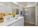Elegant bathroom with a double vanity, modern fixtures, and a glass-enclosed shower at 16824 Canopy Garden Dr, Port Charlotte, FL 33953