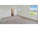 Inviting bedroom with two bright windows offering backyard views at 16824 Canopy Garden Dr, Port Charlotte, FL 33953