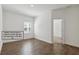 Flex space with window and wood look tile, perfect for play or home gym at 16824 Canopy Garden Dr, Port Charlotte, FL 33953